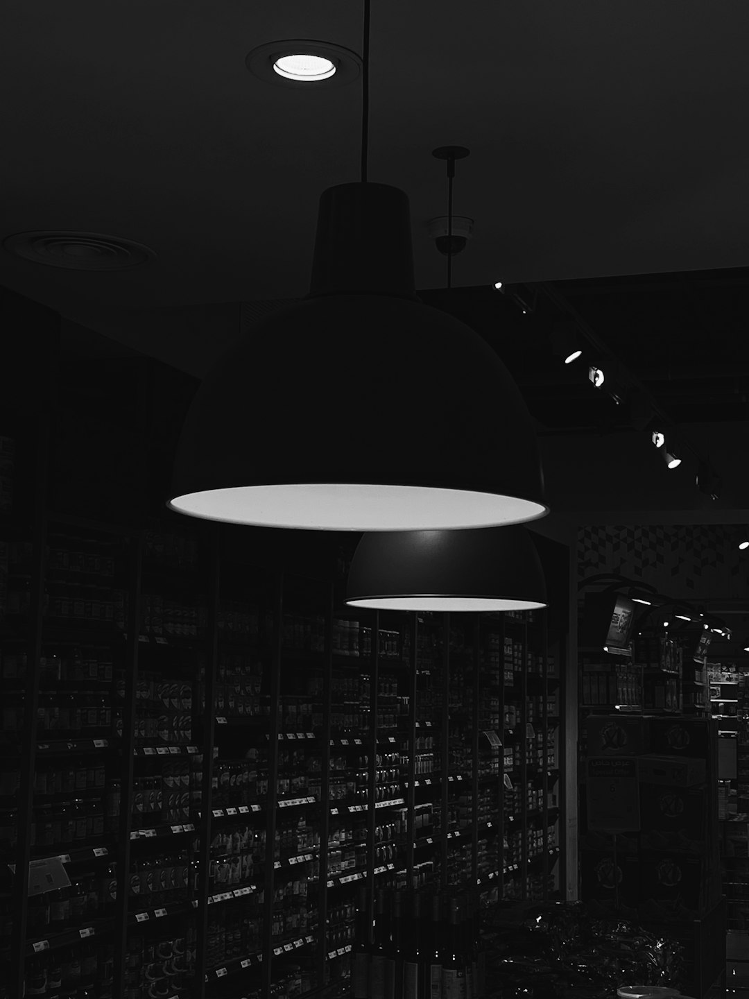 a-black-and-white-photo-of-a-store-lqtmtgv5o2w